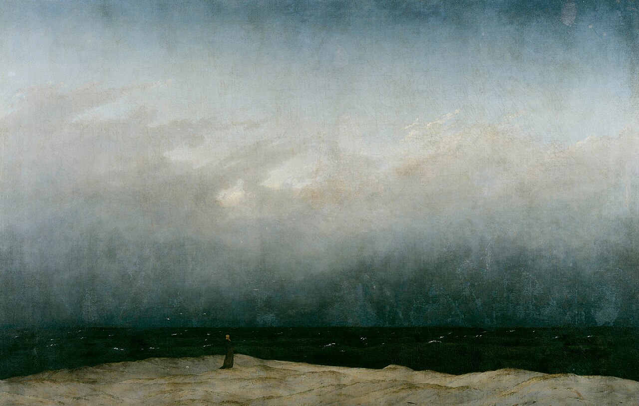 Monje frente al mar, Caspar David Friedrich (1808–1810). Una diminuta figura solitaria en una franja de playa se enfrenta al mar oscuro y a un cielo que ocupa casi toda la pintura.